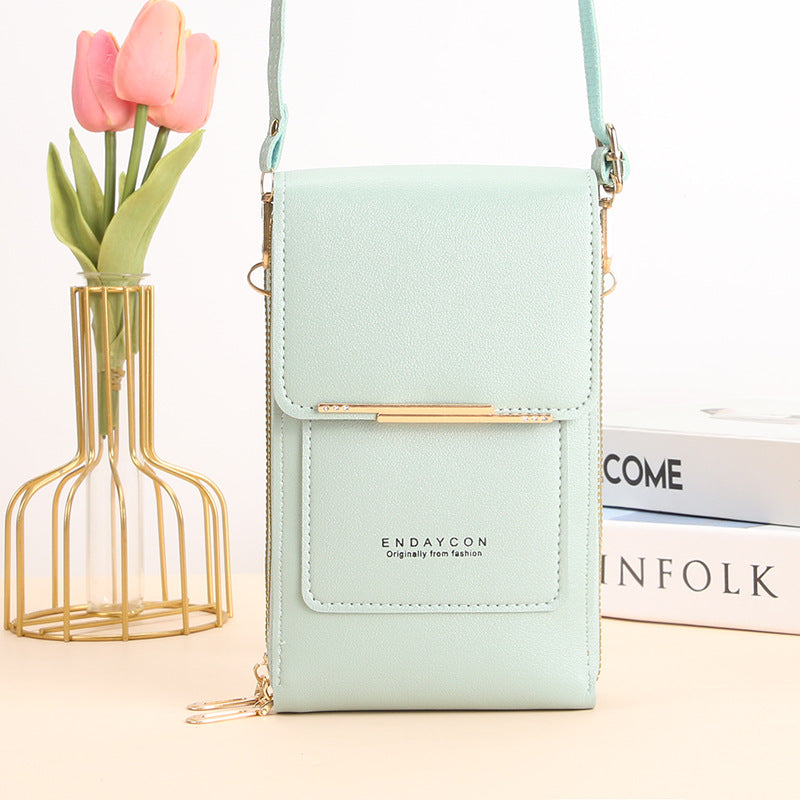 Stylish touch-screen phone messenger bag for women | Cora